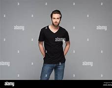 Image result for Man Black Shirt Hands Behind the Back