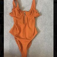 Image result for Orange Bodysuit