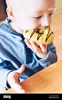 Image result for Kids Eating Donuts