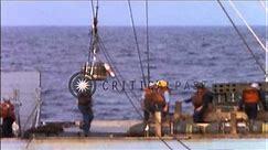 USS Mount Baker (AE-4) supply ammunition to USS Mansfield (DD-728) during Operati...HD Stock Footage