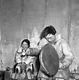 Image result for Inuit Mother Cooking