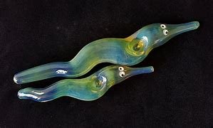 Image result for Glass Worm Figurines