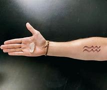 Image result for Aquarius Finger Tattoo