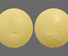 Image result for Round Yellow Pill with L On It