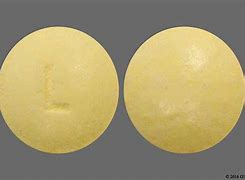 Image result for Round Yellow Pill with L On It