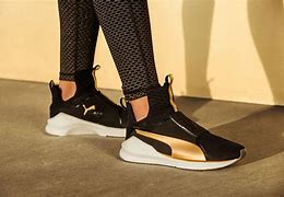 Image result for Puma Black and Gold Sneakers