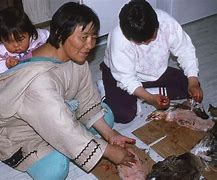 Image result for Inuit Mother Cooking