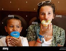 Image result for Kids Eating a Dount