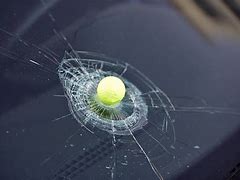 Image result for Picture of a Golf Ball Breaking Glass