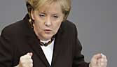 German Chancellor Merkel delivers her speech at the German lower house of parliament Bundestag in Berlin...German Chancellor Angela Merkel delivers her speech at the German lower house of parliament Bundestag in Berlin November 26