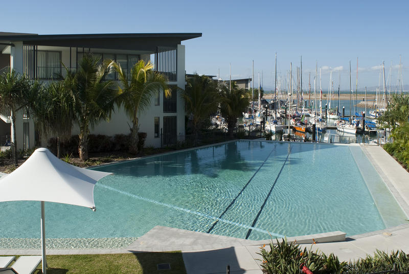 10696   Swimming pool and umbrellas at a resort