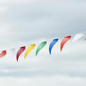 17871   String of colourful bunting against a cloudy sky