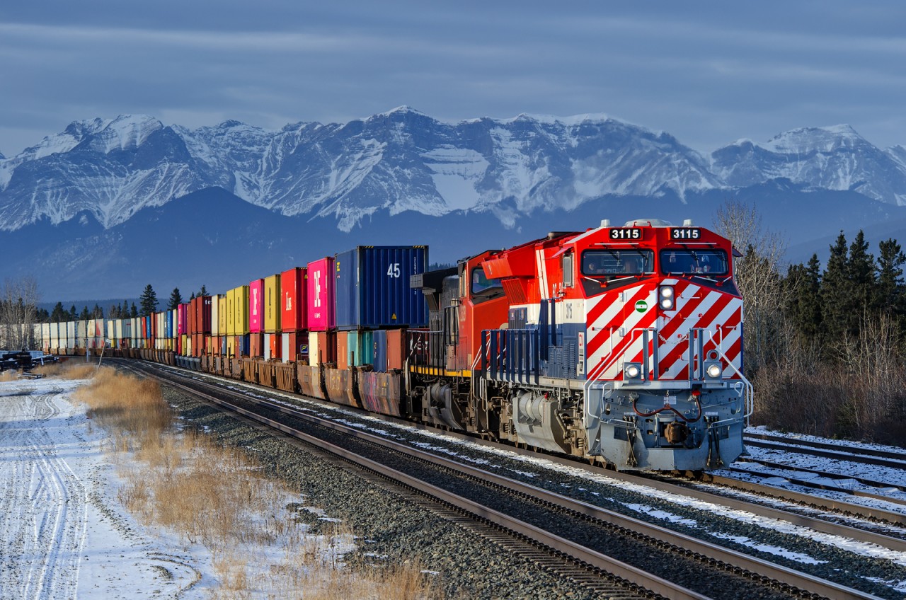 X108's train pulls into the siding track at Hinton behind the BC Rail heritage unit.