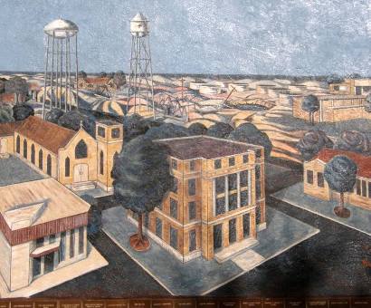 Mural in Kermit Heritage Park showing Kermit downtown & water towers