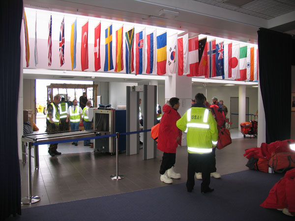 Security check - note x-ray machine and metal detector